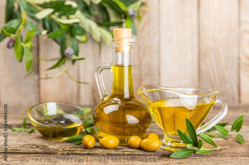 Olive oil in a bottle on texture background. Oil bottle with branches and fruits of olives. Place for text. copy space. cooking oil and salad dressing. Olive oil in a bottle on texture background. Oil bottle with branches and fruits of olives. Place for text. copy space. cooking oil and salad dressing.