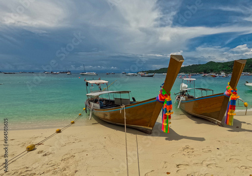 Phi Phi island one of the wonders of beauty just off the coast of phuket thailand. Phi phi island is famous for turquoise clear blue waters teaming with Corel reef fish white soft sand  © Elias Bitar