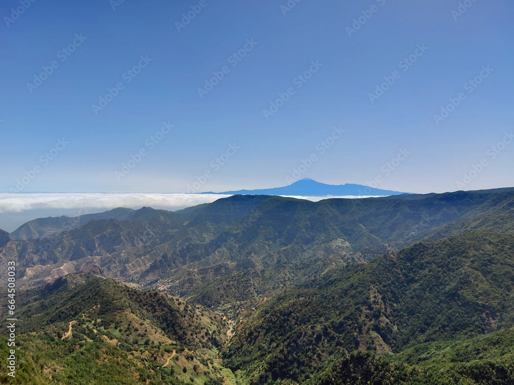 Spectacular landscape of the Teide Volcano with clouds and volcanic mountains on the island of La Gomera. Volcanoes and extreme Nature.