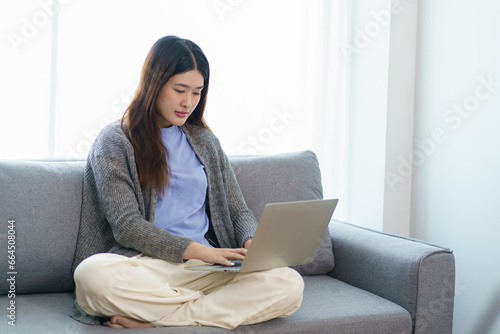 Happy beautiful Asian Woman. Business woman working from home wi