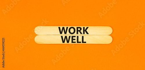 Work well symbol. Concept words Work well on wooden stick. Beautiful orange table orange background. Business marketing, motivational work well concept. Copy space.