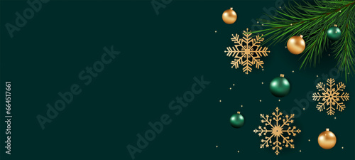 Beautiful green Christmas background with amazing golden snowflakes with various ornaments, Christmas balls, pine branches and place for text.