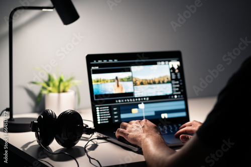 Video edit with film editor. Making movie with computer. Headphones and laptop. Sound, audio and music designer. Man working with content production software. Creative multimedia studio. Visual effect