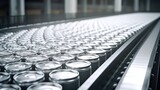 Thousands of beverage aluminum cans on conveyor line at factory.