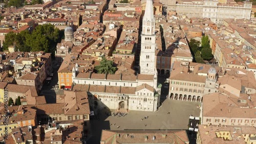 Aerial view of the Modena Cathedral and Ghirlandina, in the main square of the city. It's a Roman Catholic church dedicated to the Assumption of the Virgin Mary and Saint Geminianus located in Italy. photo