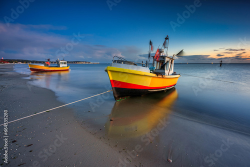 Fishing boats on the beach of Baltic Sea in Sopot at dusk, Poland