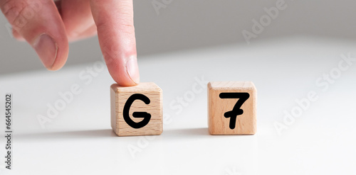 Human hand put wooden block and set technology word G7. Network future. High speed of mobile internet 