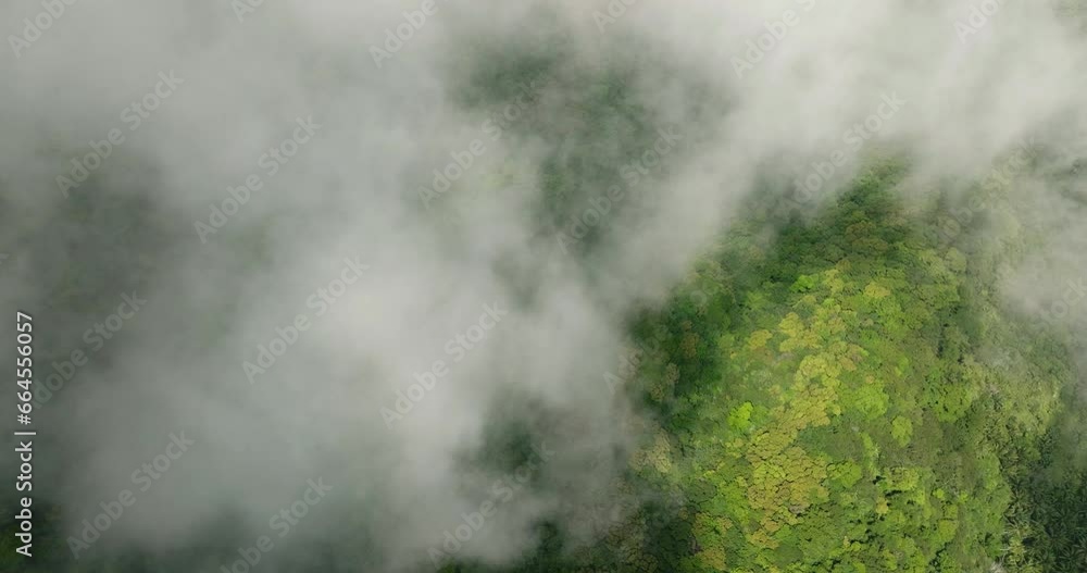 Clouds over the mountain with rainforest in Camiguin Island. Philippines. Clouds over the mountain with rainforest in Camiguin Island. Philippines.