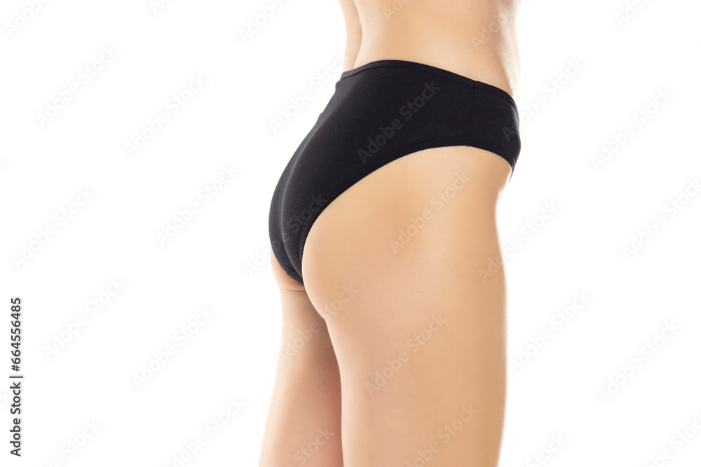 The elegance of women's bac is showcased as she stands confidently in black panties, exuding a sense of style and sophistication on a white background. Side, profile view