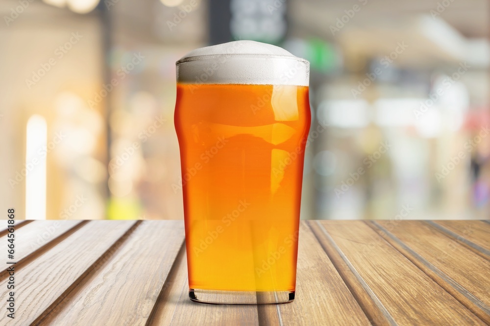 Glass of light lager cold beer on the desk Glass of light lager cold beer on the desk