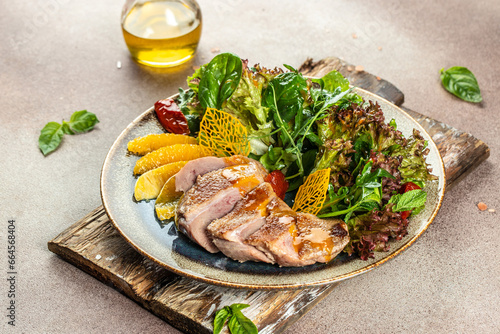 appetizer salad baked duck fillet with greens. Restaurant menu, dieting, cookbook recipe top view