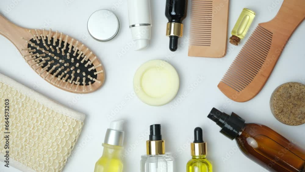 Woman putting solid shampoo to a set of natural eco-friendly cosmetics for hair care. Woman putting solid shampoo to a set of natural eco-friendly cosmetics for hair care.