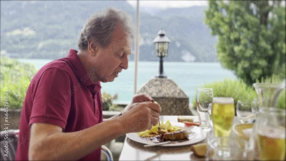 Gentleman Savors a Traditional Swiss Lunch - Swiss Sausage with Sauce, Fries, and a Cold Beer on a Pleasant Weekend by Mountains and a Lake Gentleman Savors a Traditional Swiss Lunch - Swiss Sausage with Sauce, Fries, and a Cold Beer on a Pleasant Weekend by Mountains and a Lake