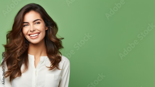 A young caucasian woman, isolated on a green background, wearing casual clothes, with a playful grin, embodying a carefree, whimsical demeanor.