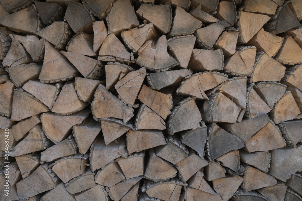 Firewood near the wall for the fireplace Firewood near the wall for the fireplace