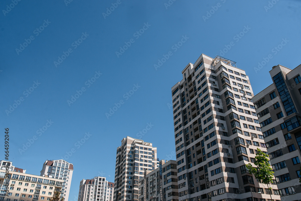 Fototapeta premium construction of residential buildings, modern glass buildings. perspective view of modern buildings.