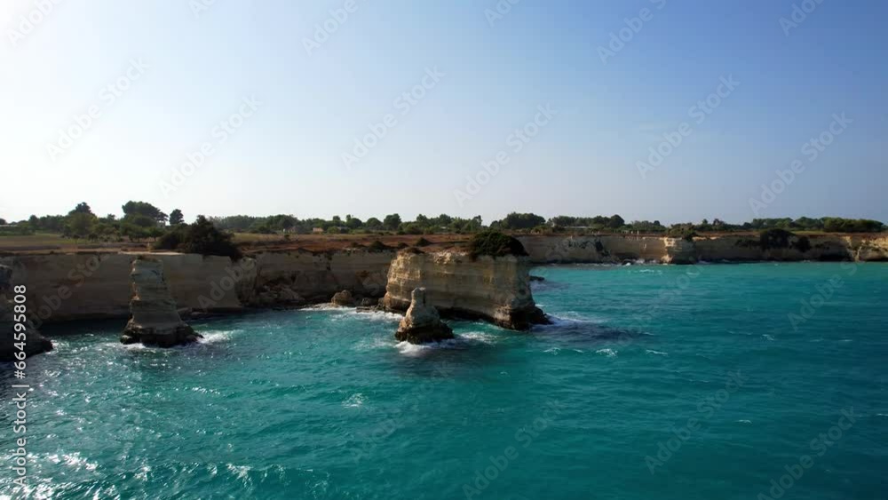 Torre Sant'Andrea - Italy - Aerial view and view from the sea of the layered rock formations Torre Sant'Andrea - Italy - Aerial view and view from the sea of the layered rock formations