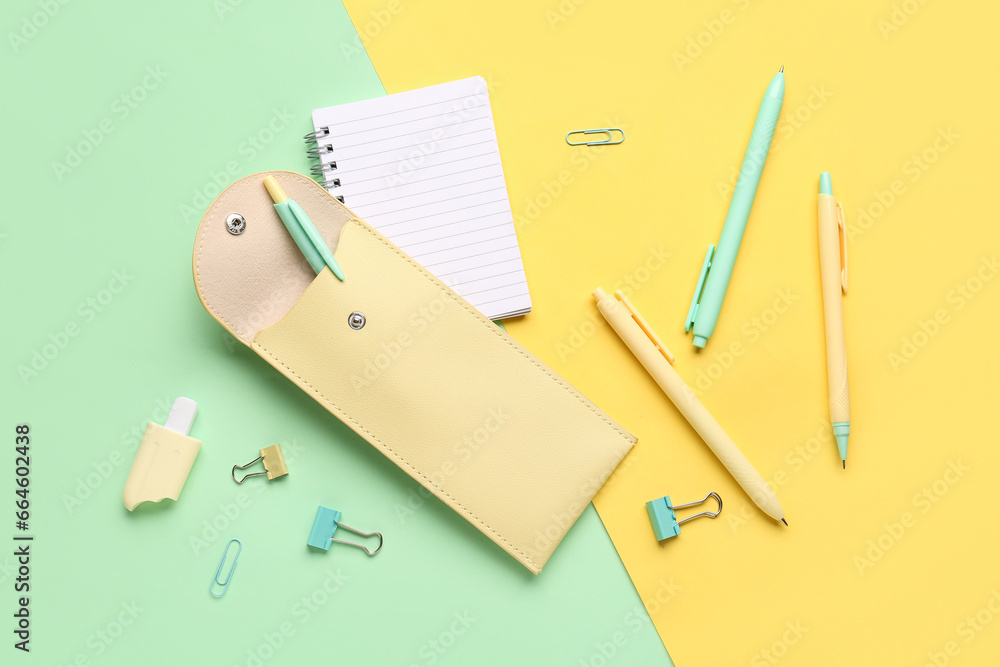 Beige pencil case with school stationery on color background Beige pencil case with school stationery on color background