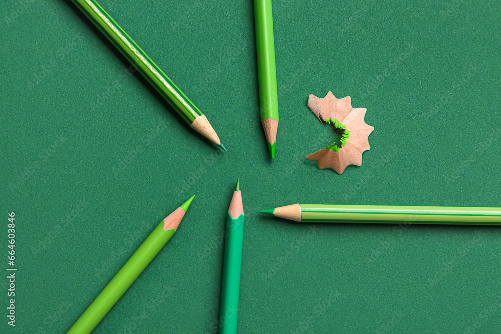 Set of color pencils on green background Set of color pencils on green background