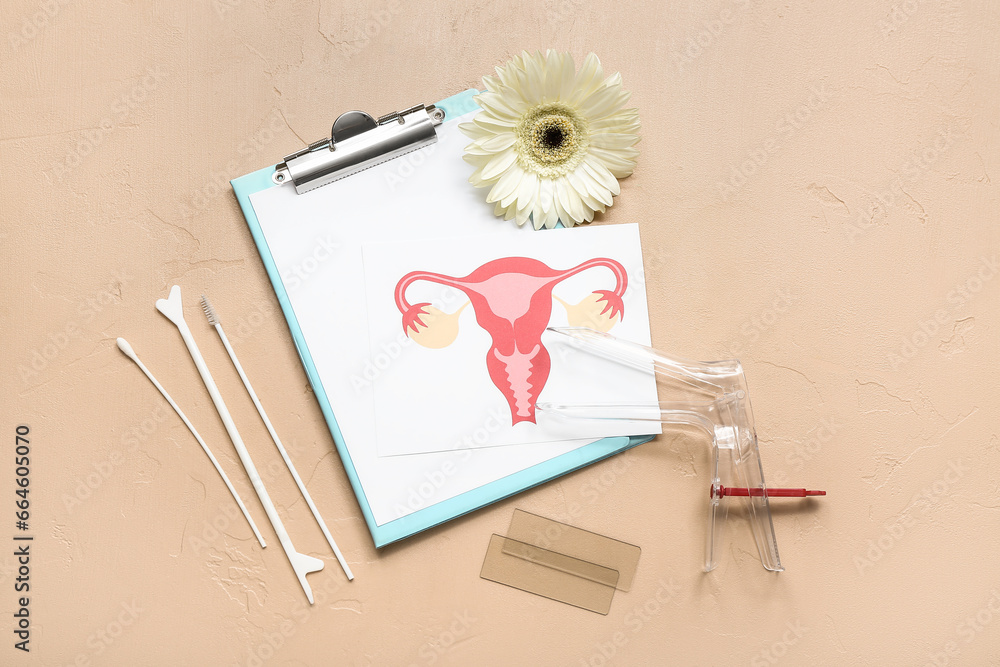 Gynecological speculum, drawing of female uterus, clipboard and pap