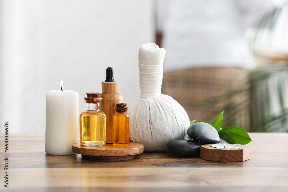 Composition with spa accessories and bottles of cosmetic products on wooden table Composition with spa accessories and bottles of cosmetic products on wooden table