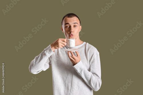 Young man with cup of hot c...