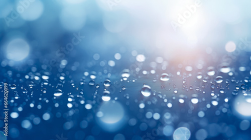 Rain drops on window glass, abstract background with bokeh effect