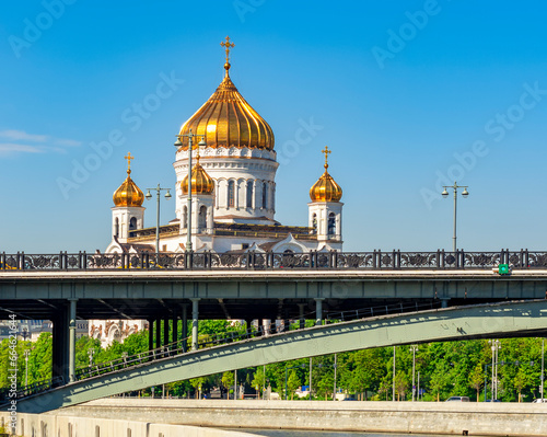 Large stone bridge with Cathedral of Christ the Savior at background, Moscow, Russia photo