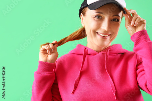 Mature woman in fuchsia hoo...