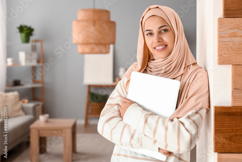 Smiling young muslim woman ...