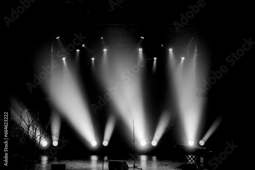 Empty stage lit up in lights, black and white image