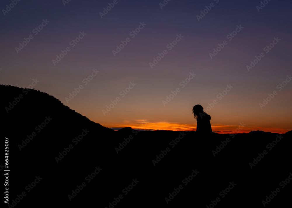 Male silhouette in Strazovske hills in autumn evening near Podskalie village