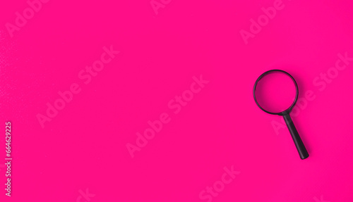 Wallpaper Mural Magnifying glass, magnifying glass in a black frame on a pink background.  Concept research, objects magnification.  Flat top view.  Space for copying text.Magnifying glass, magnifying glass in a blac Torontodigital.ca