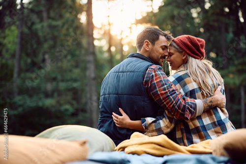 Romantic couple in love on camping in nature during autumn.