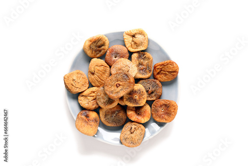 Plate with sweet dried figs on beige background