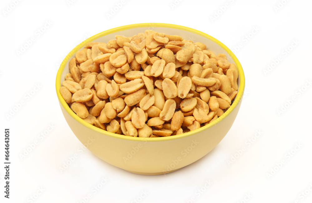 Yellow bowl full of roasted salty peanuts isolated on white background Yellow bowl full of roasted salty peanuts isolated on white background
