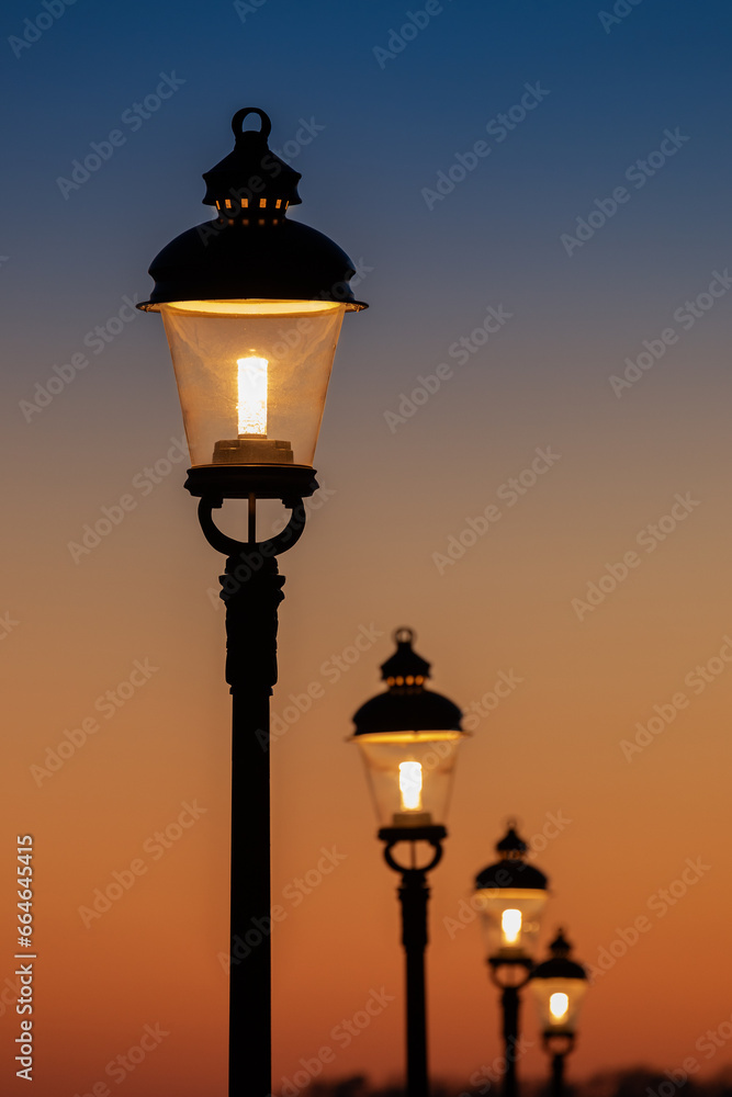 Vintage street lamps at sunset.