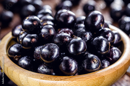 bowl with many jabuticabas, exotic south american grape native to brazil, bolivia and argentina photo