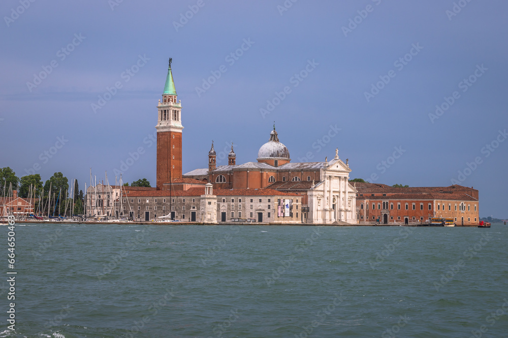 Fototapeta premium Exposure Exposure of the Gondolas in Venice with the Abbazia in the background, on a sunshiny day showing the pretty views of this magnificent city.