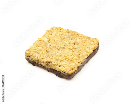 Square shaped oat bar dipped in chocolate on one side isolated on white background.