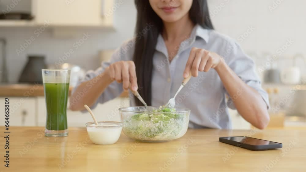 Portrait of happy playful asian girl eating fresh salad in diet concept. Portrait of happy playful asian girl eating fresh salad in diet concept.
