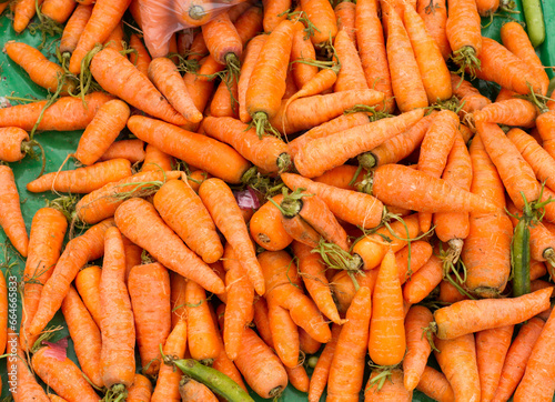 Photograph of a group of carrots in a South American market. Food concept.