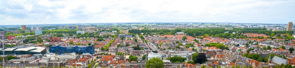Panoramic view of Amsterdam skyline, rooftops, city life, no people