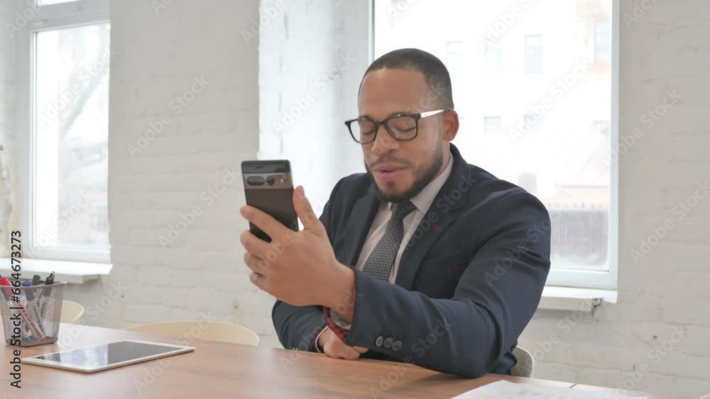 Mixed Race Businessman Doing Video Chat on Phone