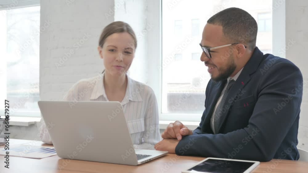 Mixed Race Business People Working on Laptop Mixed Race Business People Working on Laptop