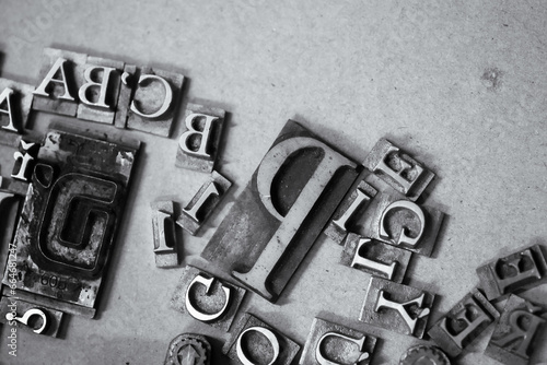 Antique printing press letters close-up metallic color photo