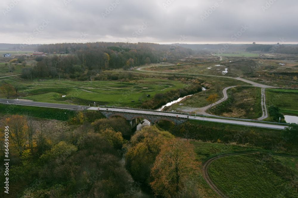 Aerial view of 19th century historic masonry bridge in Kretingale, small town in in Klaipeda County, in northwestern Lithuania.