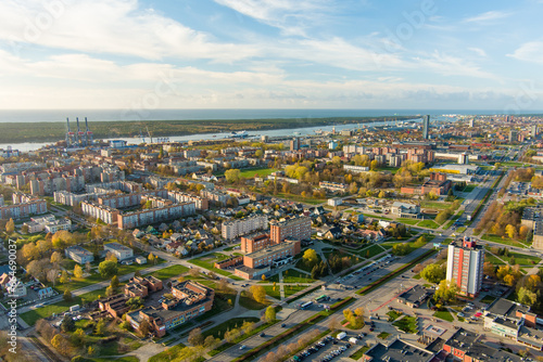 Aerial view of residential area of Klaipeda, Lithuania on sunny evening. Klaipeda city port area and it's surroundings on autumn day.