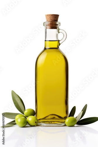 bottle of olive oil and green olives with leaves on a white background. Close-up. salad dressing in the kitchen.