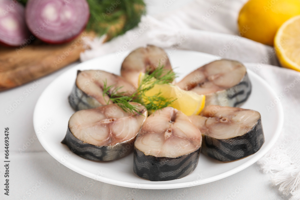 Slices of tasty salted mackerel on white table, closeup Slices of tasty salted mackerel on white table, closeup